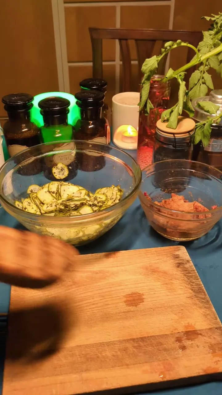 Zucchini being arranged on toasted bread