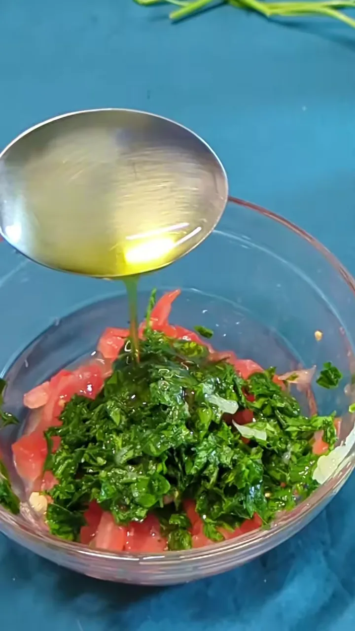 Lemon dressing being mixed in a small bowl